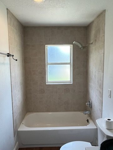 Bathtub with new tile surround