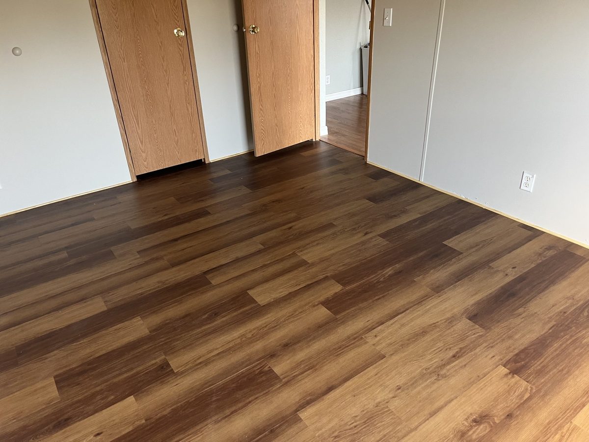 New plank flooring installed in a bedroom in Ocala