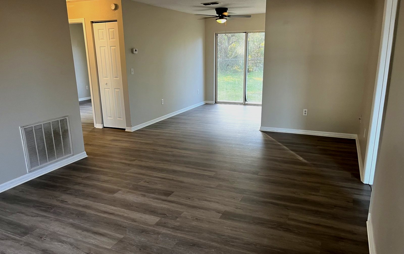 Living room in a Central Florida home with newly installed vinyl plank flooring by Handyman Homes